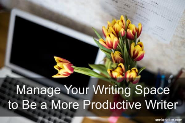 yellow tulips next to laptop - Manage Your Writing Space to Be a More Productive Writer